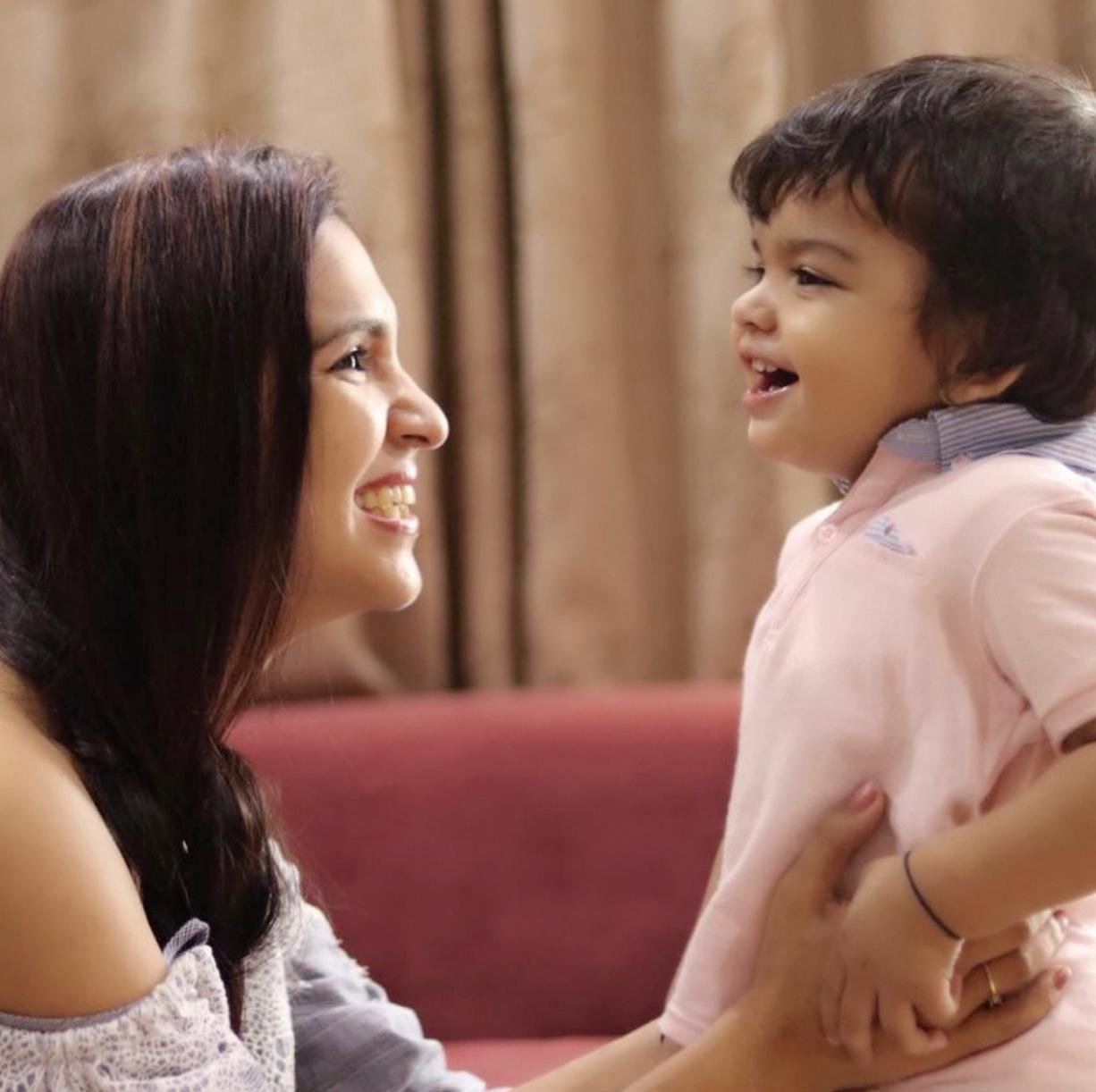 Talking to my son and asking him questions to ensure child's overall growth 